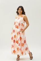 Woman wearing a floral dress on a white background